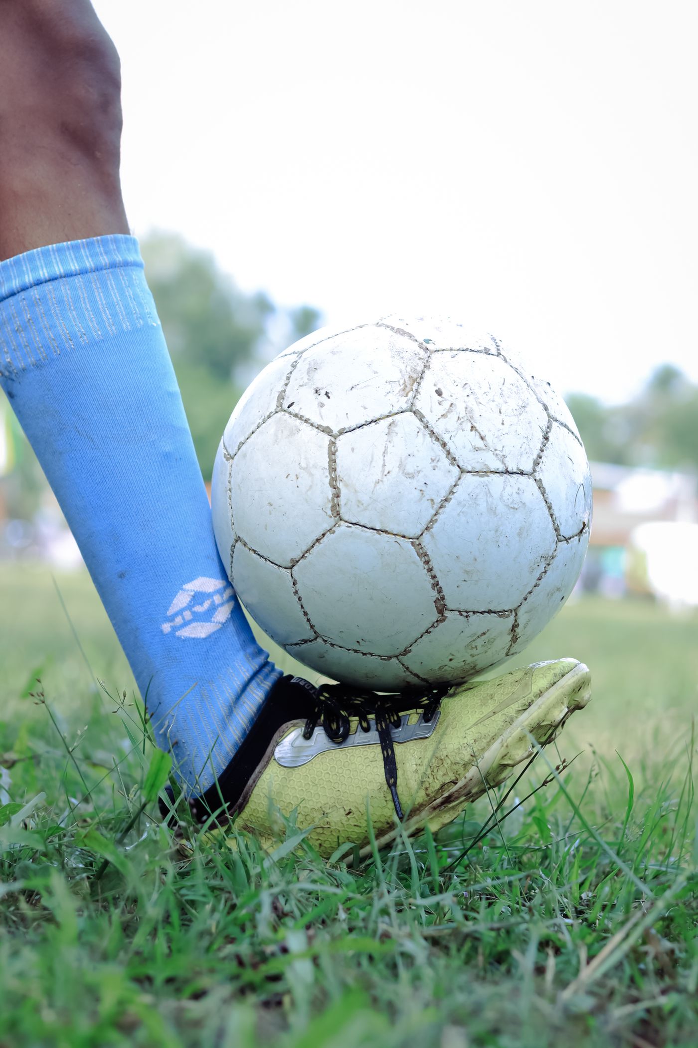 Close-up of a player controlling the ball with his foot