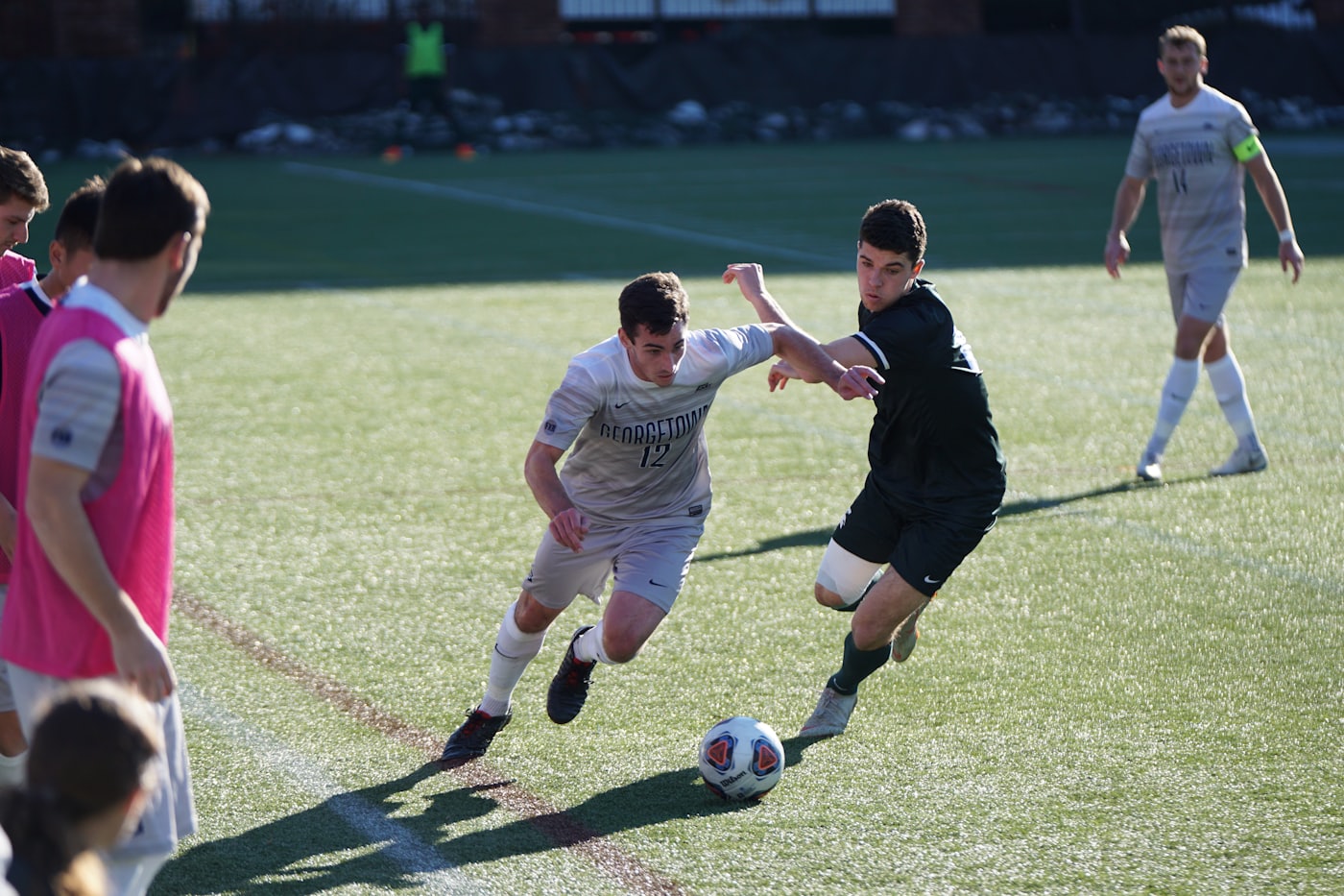 Two players competing for the ball during a match