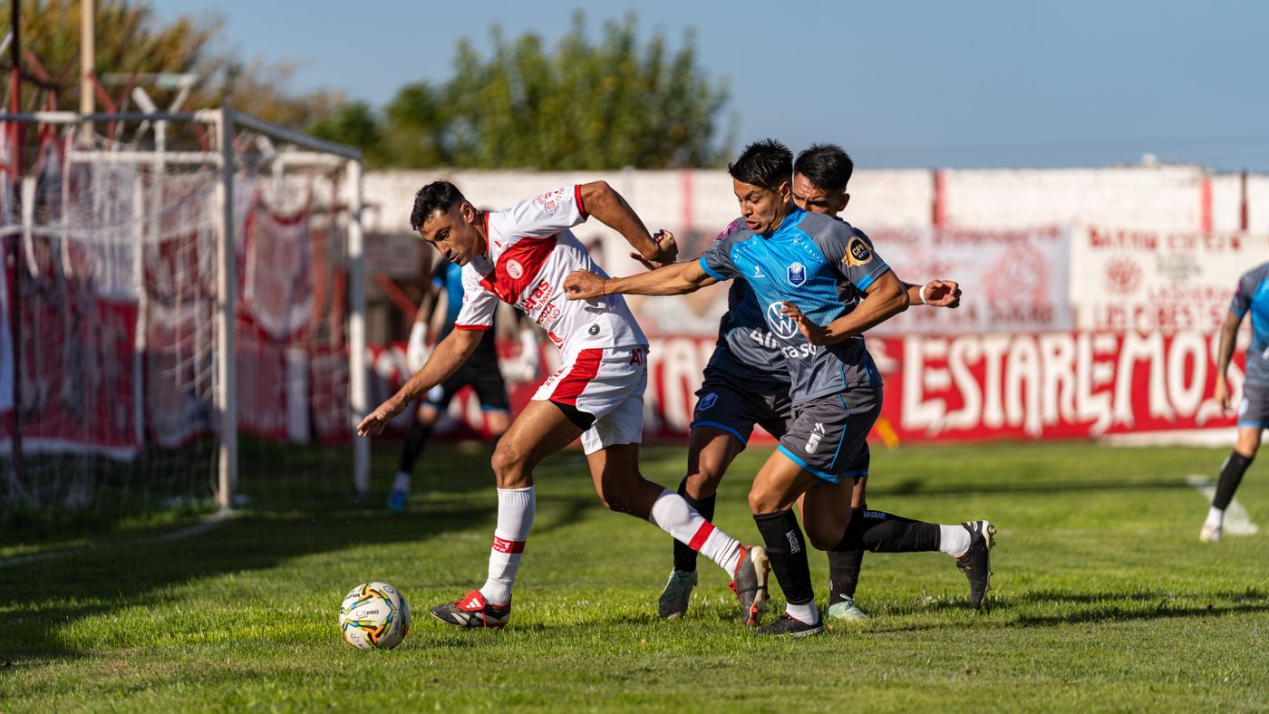 Players tangled together as they compete for the ball